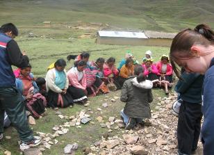 Quechua people praying to receive Christ in an Andean community